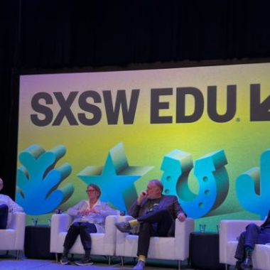Panelists sit on the stage for the SXSW EDU education conference.
