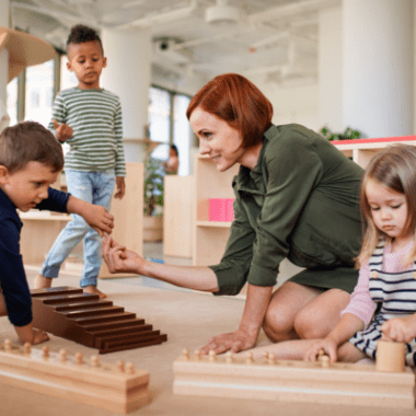 Preschool children play a game with a teacher.