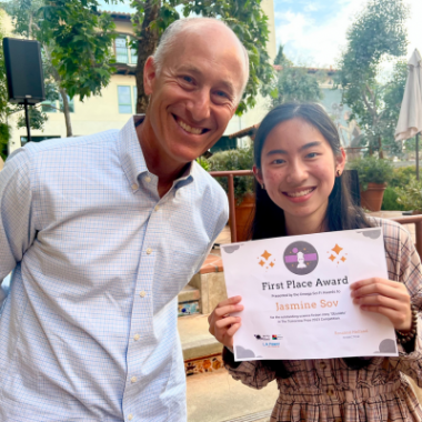 L.A. Parent Publisher presents high school student Jasmine Son with the first-place award for The Tomorrow Prize in sci-fi writing.